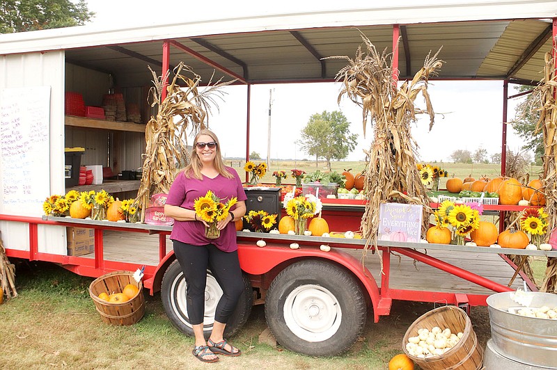 LYNN KUTTER ENTERPRISE-LEADER
Ashley Swaffar stands in front of her produce stand, which is open all the time for people to purchase vegetables and pay using the honor system. Her farming business is called Rheas Mill Gardens.