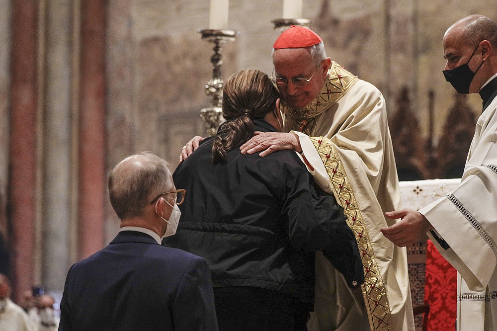 Cardinal Agostino Vallini (right) embraces the mother of the 15-year-old Carlo Acutis, who is on his way to becoming the first millennial to be recognized as a saint in the Roman Catholic Church, during the boy’s beatification last week at Assisi, Italy’s St. Francis Basilica.
(AP/Gregorio Borgia)