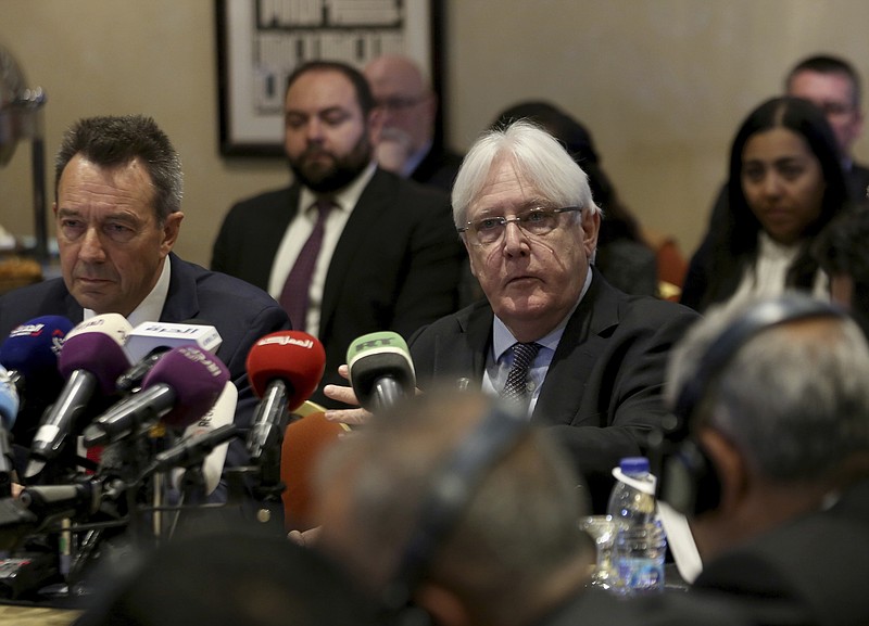 FILE - In this Feb. 5, 2019 file photo, United Nations Special Envoy to Yemen Martin Griffiths, center, and President of the International Committee of the Red Cross Peter Maurer, speak during a new round of talks by Yemen's warring parties in Amman, Jordan.  Yemen’s warring sides on Friday, Sept. 18, 2020,  started U.N.-brokered peace consultations in Switzerland to exchange prisoners, the United Nations said, part of a long-delayed deal aiming to end a conflict that has killed thousands of civilians and set off the world’s worst humanitarian crisis. (AP Photo/Raad Adayleh)
