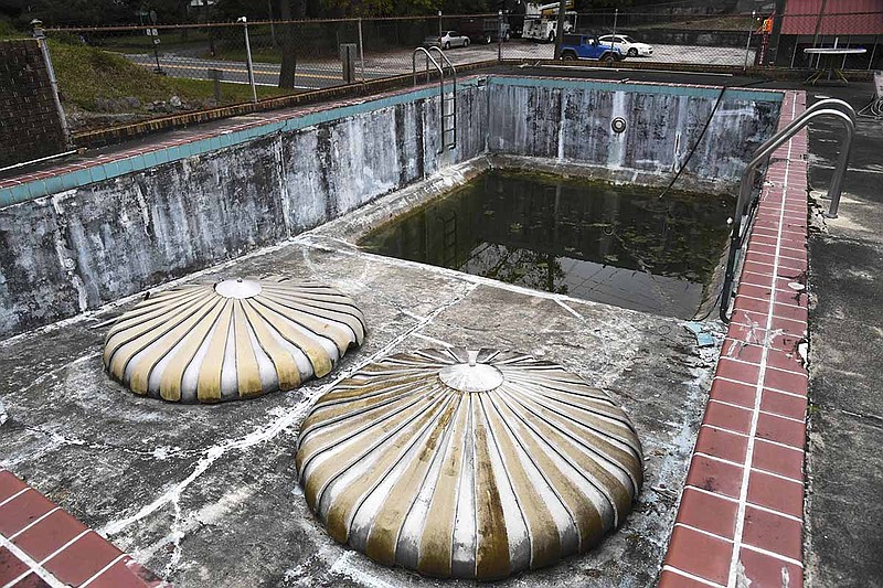 The empty pool at Perry Plaza, 1007 Park Ave., is part of the property purchased by Realtor Chris Rix. - Photo by Grace Brown of The Sentinel-Record