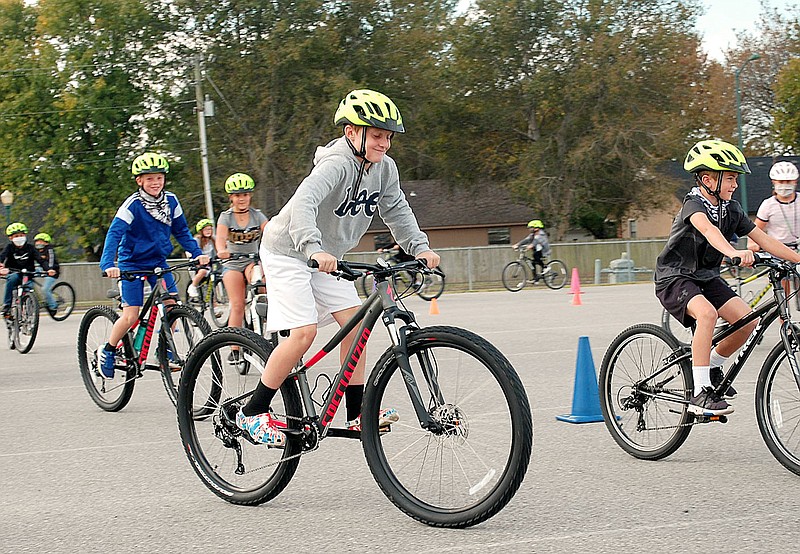 Janelle Jessen/Siloam Sunday
Fifth graders practice riding bicycles during a physical education class at Siloam Springs Intermediate School.