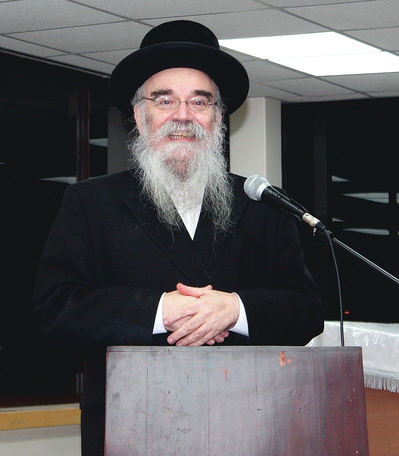 In this Dec. 20, 2017 photo provided by Joel Friedman, Rabbi Avrohom Pinter makes a speech at Canvey Island,in Essex, southeast England. Pinter gave his life to save his neighbors. When the British government ordered a lockdown to slow the spread of coronavirus, Pinter went door-to-door to deliver the public health warning to the ultra-Orthodox Jews in northeast London. Within days, the 71-year-old rabbi had caught the disease and died.  (Joel Friedman via AP)