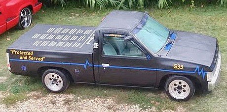 Submitted Photo
Shane Hargrave, of Gravette, has fitted out his 1996 Nissan pickup as a memorial to fallen police officers in Benton and Washington County. He has painted the name of officers lost on the bed cover of the pickup, which he calls "Low Enforcement."