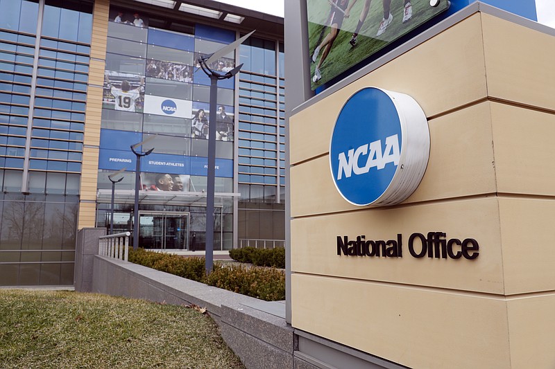 FILE - In this March 12, 2020, file photo, the national office of the NCAA in Indianapolis is shown. A set of proposals to permit NCAA athletes to earn money from endorsements and sponsorships deals will go up for vote in January, the last step for the association to change its rules but not the last word on how name, image and likeness compensation will work.   (AP Photo/Michael Conroy, File)