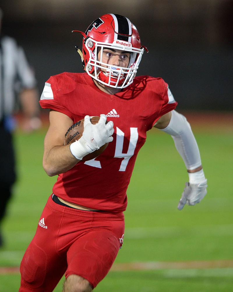 Farmington running back Caden Elsik (24) carries the ball Friday, Oct. 16, 2020, through the Clarksville defense during the first half of play at Cardinal Stadium in Farmington. Visit nwaonline.com/201017Daily/ for today's photo gallery. 
(NWA Democrat-Gazette/Andy Shupe)