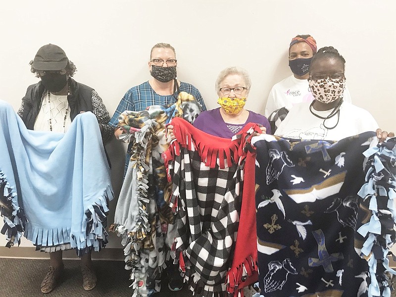 New Horizon EHC members show off the No Sew blankets they made for the Retired and Senior Volunteer Program. Members include, from left, Sharon Johnson, Wanda Kongenski, Marion Shorey, Dot Hart and Kim Edwards. Special to The Commercial