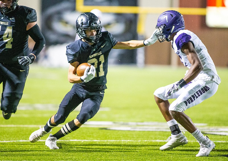 Ryan Garrett (74) leading the way for Sean Anderson (21) of  Bentonville against Fayetteville  at Tigers Stadium, Bentonville, Arkansas on Friday, October 16, 2020 / Special to NWA Democrat-Gazette/ David Beach