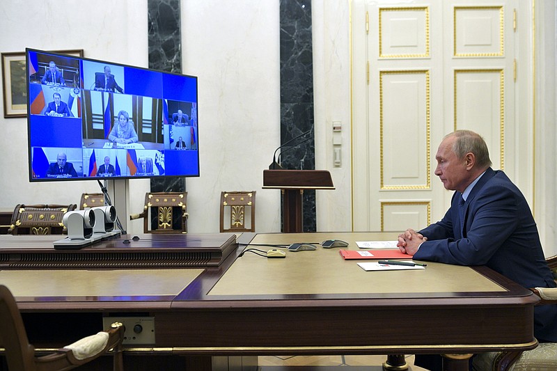Russian President Vladimir Putin chairs a Security Council meeting via video conference in Moscow, Russia, Friday, Oct. 16, 2020. (Alexei Druzhinin, Sputnik, Kremlin Pool Photo via AP)