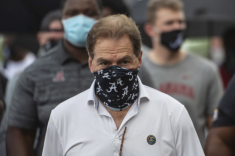 In this Aug. 31, 2020, file photo, Alabama head football coach Nick Saban leads his team as they march on campus in Tuscaloosa, Ala. 
(AP Photo/Vasha Hunt, File)