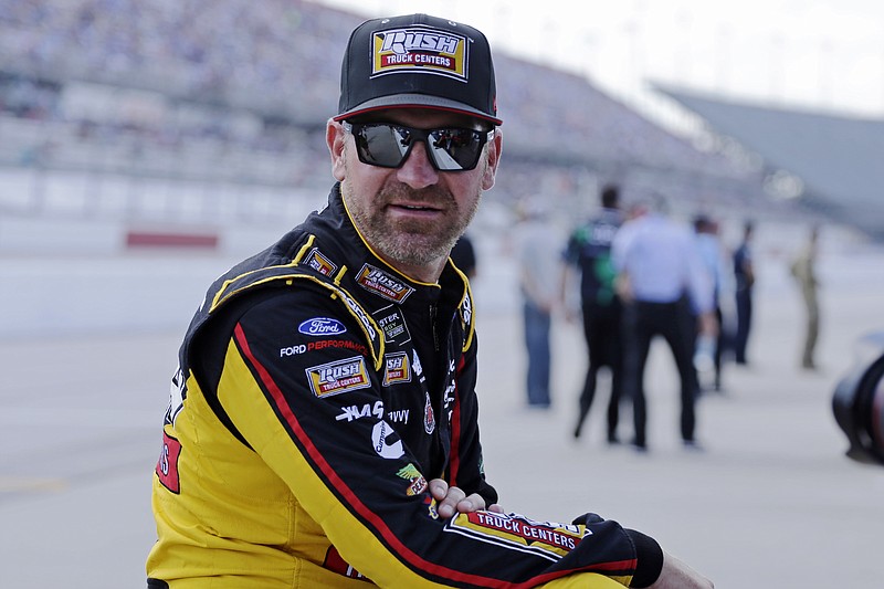 Clint Bowyer waits on pit road on Aug. 31, 2019, for his turn to qualify for the NASCAR Cup Series auto race at Darlington Raceway in Darlington, S.C. Bowyer, popular among his peers and a beloved by fans, would have preferred a proper send-off in his final year as a NASCAR driver. Instead, he’ll settle for a farewell party Sunday at Kansas Speedway. Bowyer is retiring from racing at the end of this season and move into the Fox Sports booth. - Photo by Terry Renna of The Associated Press story.lead_photo.caption