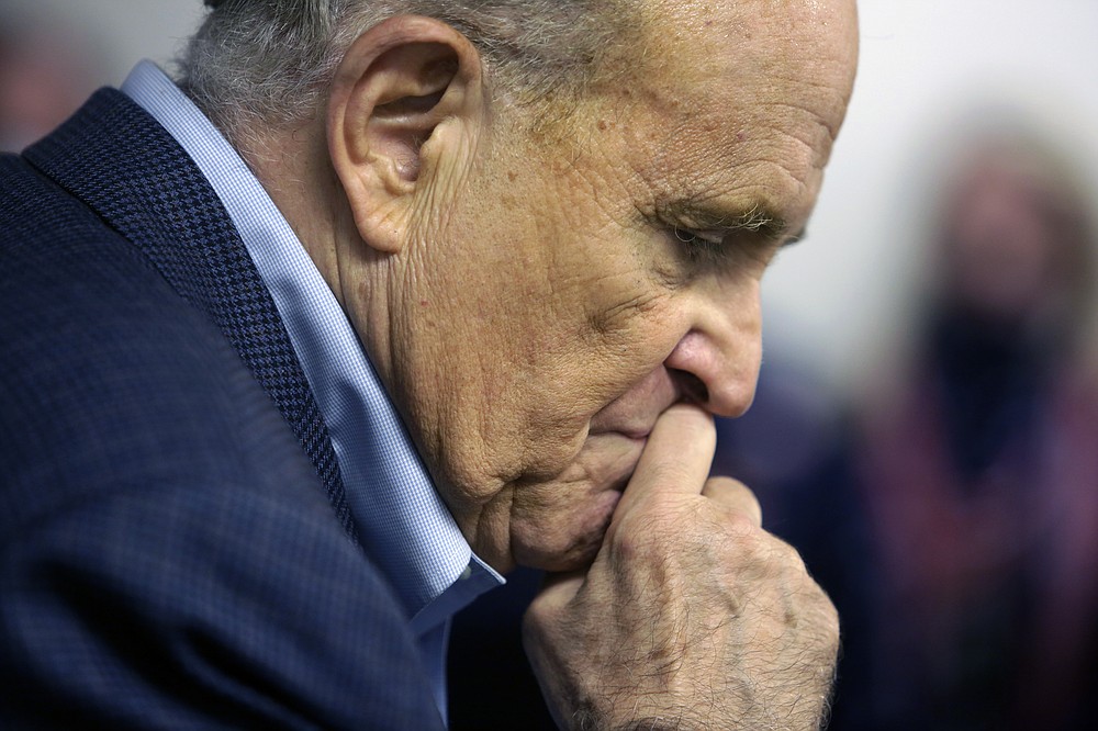 Former New York Mayor Rudy Giuliani pauses while addressing supporters of President Donald Trump Monday, Oct. 12, 2020 during a Columbus Day gathering at a Trump campaign field office in Philadelphia. (AP Photo/Jacqueline Larma)