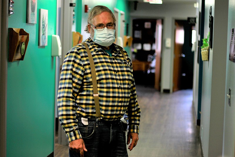 Dr. Tom Dean pstands at his clinic in Wessington Springs, S.D., on Friday. Dean is one of three doctors in the county, which has seen one of the nation's highest rates of coronavirus cases per person. He writes a column in the local newspaper, the True Dakotan, urging people to take precautions against the virus. - AP Photo/Stephen Groves story.lead_photo.caption