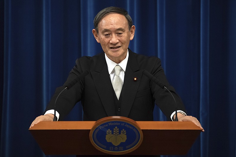 FILE - In this Sept. 16, 2020, file photo, Japan's new Prime Minister Yoshihide Suga speaks during a press conference at the prime minister's official residence in Tokyo, Japan. Japan's new Prime Minister Suga heads to Vietnam and Indonesia on Sunday, Oct. 18, 2020, on his first overseas foray since taking over from his former boss Shinzo Abe last month. (Carl Court/Pool Photo via AP, File)