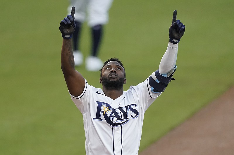 Tampa Bay Rays Randy Arozarena celebrates after hitting a two run home run against the Houston Astros Saturday during the first inning in Game 7 of the American League Championship Series in San Diego. - Photo by Ashley Landis of The Associated Press story.lead_photo.caption
