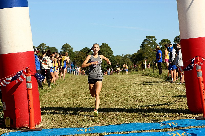 Fayetteville’s Carson Wasemiller powers through to the finish line at the Lake Hamilton Invitational Saturday to win the event. - Photo by James Leigh of The Sentinel-Record