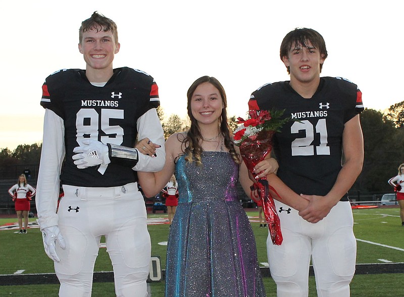 Courtesy Photo Junior queen attendant Libby Cisneros is escorted by Wade Rickman (85) and Racey Shandley (21).