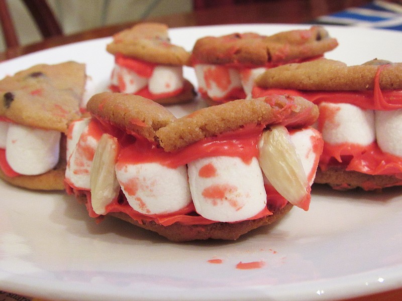 Dracula Dentures are chocolate chip cookies cut in half, smeared with red icing, studded with a row of miniature marshmallows and rejoined. (Special to the Democrat-Gazette/Kimberly Dishongh)