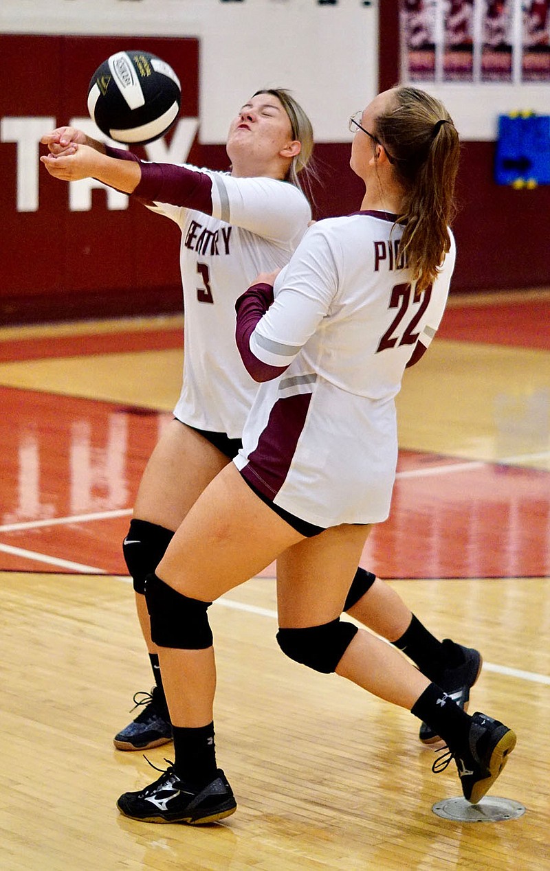 Westside Eagle Observer file photo/RANDY MOLL
Gentry's Afton Finnell, backed up by Malea Wilson, sets up a ball during the Oct. 8 match against Gravette in Gentry.