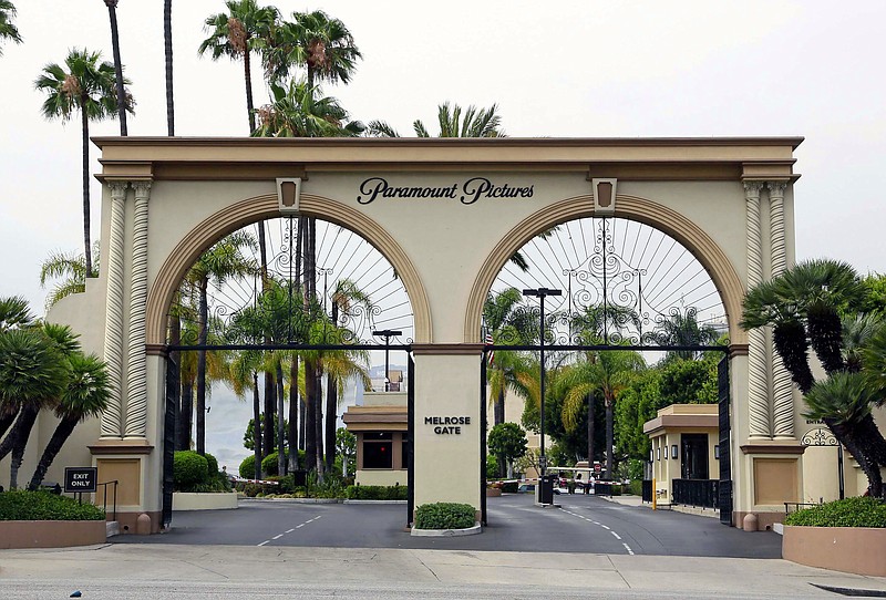 FILE - This July 8, 2015, file photo shows the main gate to Paramount Studios on Melrose Avenue in Los Angeles. Authorities have arrested a sexual assault suspect on the Paramount Pictures studio lot in Hollywood after a two-hour standoff with police. The man who was arrested early Monday, Oct. 19, 2020, 36-year-old Bryan Gudiel Barrios, works on the studio lot but it is not clear if he is a contractor or employee of Paramount Pictures.  (AP Photo/Nick Ut, File)