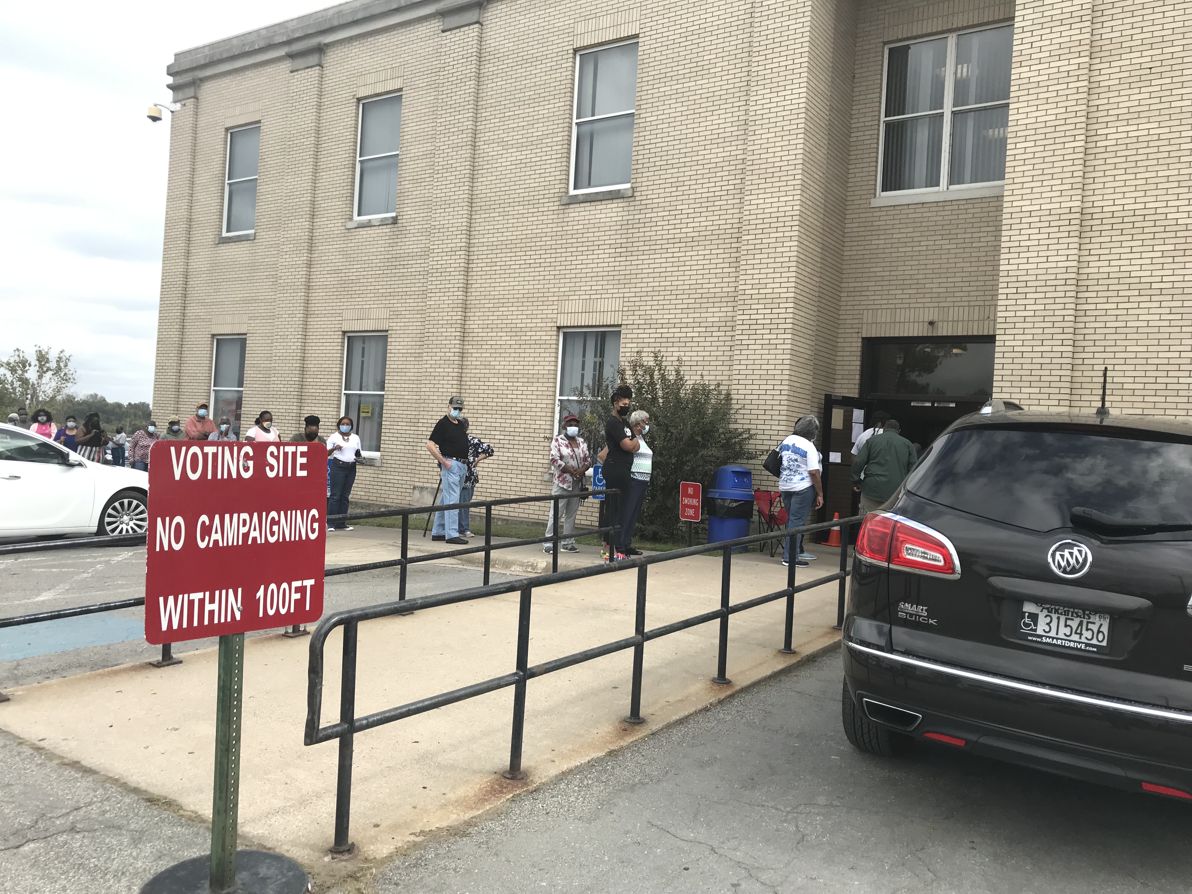 Residents file around courthouse for state’s first day of early voting