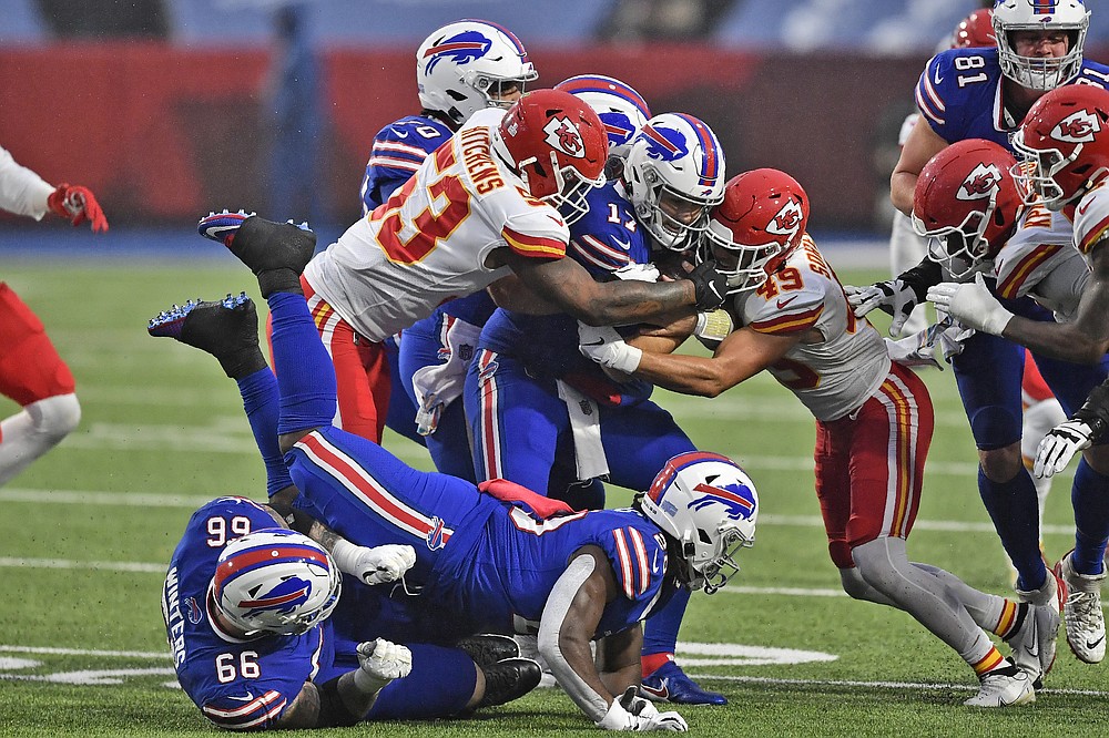 Chiefs kept on the ground, but run past Bills anyway