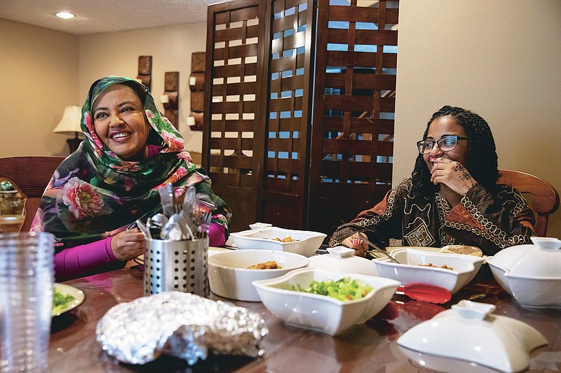 Shaza Elsamani, left, and Didi Elsyad celebrate Eid al-Adha in July. MUST CREDIT: Photo for The Washington Post by Amanda Andrade-Rhoades