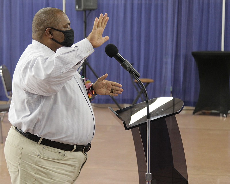 Sederick Rice, assistant professor of Biology at UAPB, gestures as he describes his proposal to provide five virtual cockpit flight simulators to area high schools as a way of getting students interested in aviation and providing them with the fundamentals to move into actual flight training in college. (Pine Bluff Commercial/Dale Ellis)