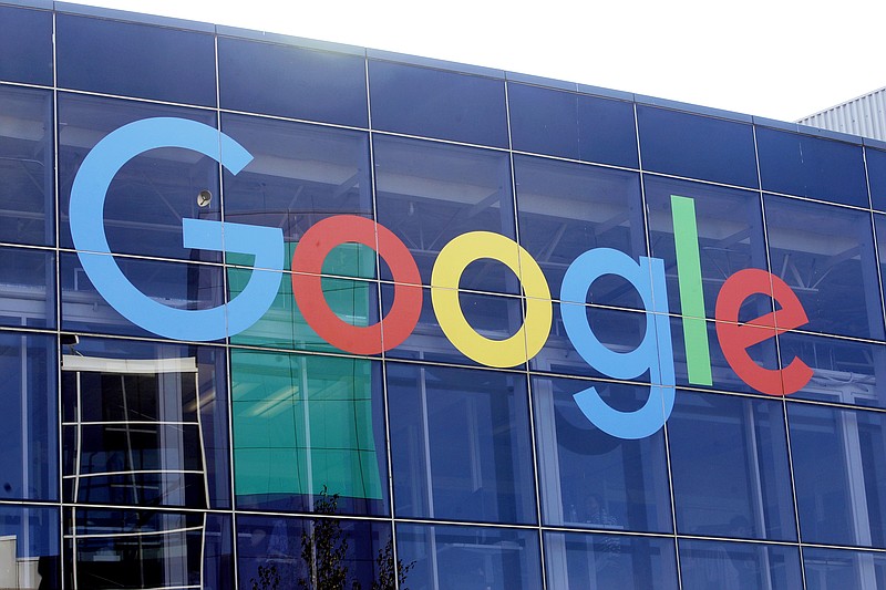 FILE - In this Sept. 24, 2019, file photo a sign is shown on a Google building at their campus in Mountain View, Calif.  The Justice Department is expected to file a lawsuit Tuesday alleging that Google has been abusing its online dominance in online search to stifle competition and harm consumers. The litigation marks the government’s most significant act to protect competition since its groundbreaking case against Microsoft more than 20 years ago. The suit could be an opening salvo ahead of other major government antitrust actions, given ongoing investigations of major tech companies including Apple, Amazon and Facebook at both the Justice Department and the Federal Trade Commission.  (AP Photo/Jeff Chiu, File)