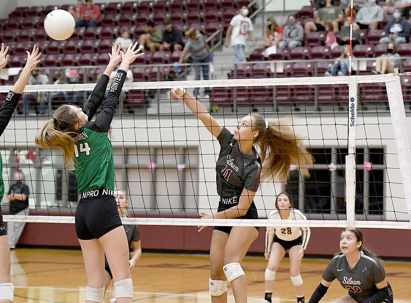 Bud Sullins/Special to the Herald-Leader
Senior Jaedyn Soucie hammers a ball past the Van Buren block during Tuesday's volleyball match at Panther Activity Center. The Lady Panthers swept the Lady Pointers 3-0 in their final home match of the season.