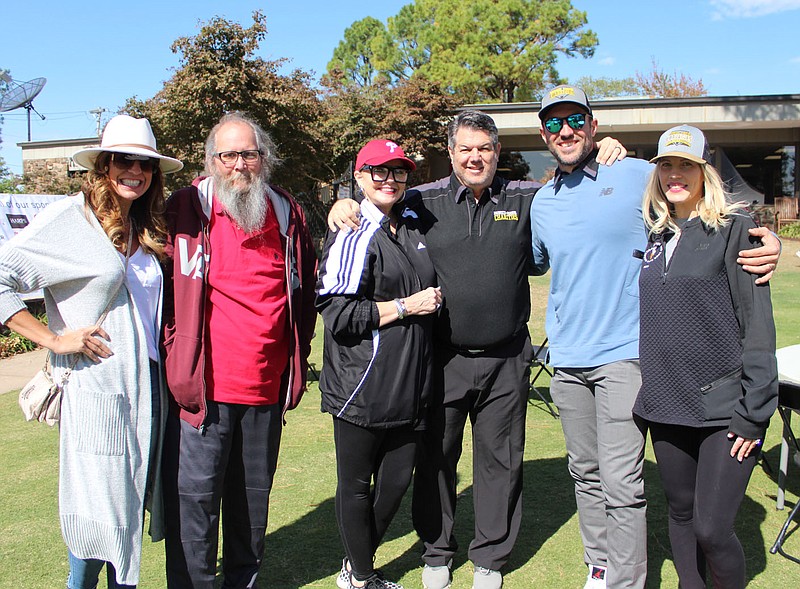 Brooke McDonald (from left), Joe Walters, Vikki Parker, Tom Pagnozzi and Blake and Jordan Parker welcome golfers to the Pagnozzi Parker Charity Golf Tournament on Oct. 16 at Paradise Valley Athletic Club in Fayetteville.
(NWA Democrat-Gazette/Carin Schoppmeyer)