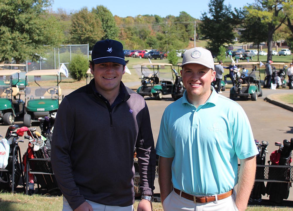 Scott Purvis (left) and Mason Lester stand for a photo at the Pagnozzi Parker golf tournament. 
(NWA Democrat-Gazette/Carin Schoppmeyer)