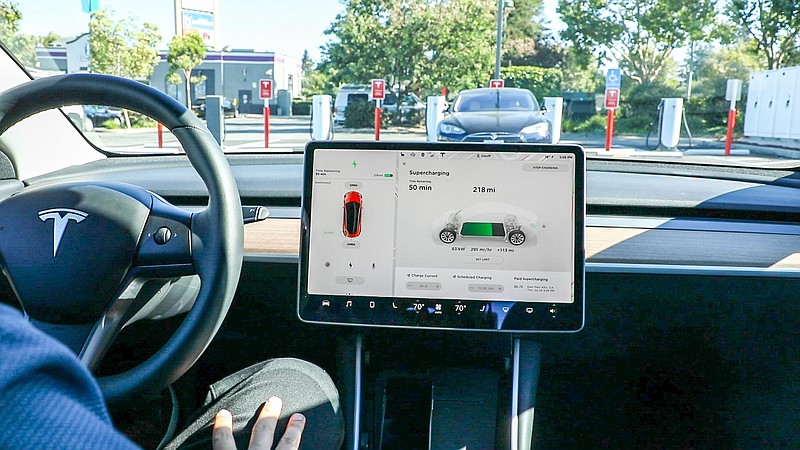 Inside the Tesla Model 3, the dashboard is mostly contained in a touchscreen in the center of the front console. There's no information directly behind of the steering wheel. MUST CREDIT: Washington Post photo by Jhaan Elker.