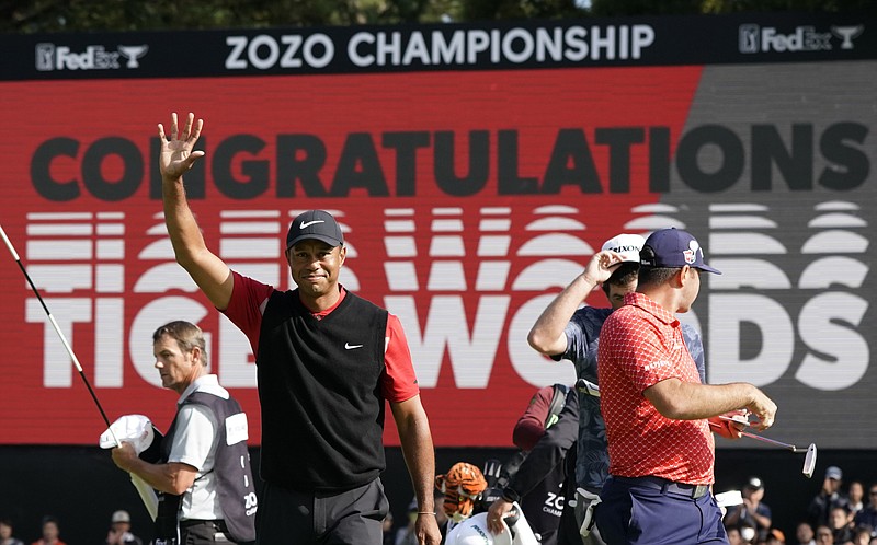 FILE  - In this Oct. 28, 2019, file photo, Tiger Woods celebrates after winning the Zozo Championship golf tournament at the Accordia Golf Narashino country club in Inzai, east of Tokyo, Japan. Woods is the defending champion at a course where he has won five times. The Zozo Championship is the second Asia-based event to move to the United States this year because of the COVID-19 pandemic. (AP Photo/Lee Jin-man, File)