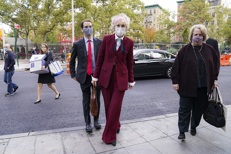 E. Jean Carroll arrives at the Daniel Patrick Moynihan United States Courthouse, Wednesday, Oct. 21, 2020, in New York. Carroll, who says President Donald Trump raped her in the 1990s, was expected to be in court Wednesday to hear lawyers argue whether Trump can substitute the United States for himself as the defendant in her defamation lawsuit.  (AP Photo/John Minchillo)