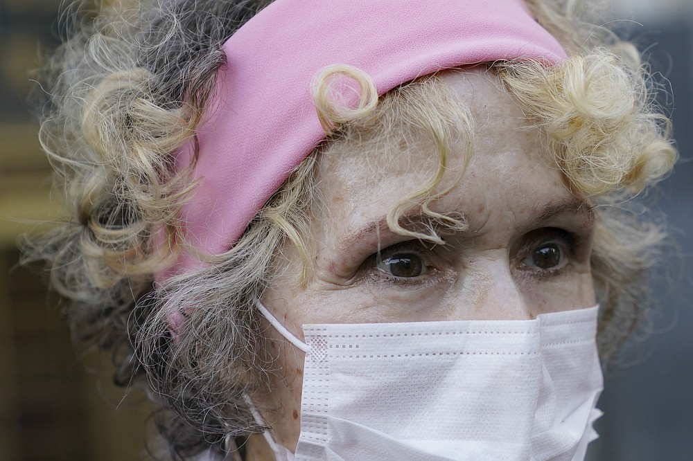 E. Jean Carroll, who says President Donald Trump raped her in the 1990s, leaves the Daniel Patrick Moynihan United States Courthouse following a hearing in her defamation lawsuit against Trump, Wednesday, Oct. 21, 2020, in New York. (AP Photo/John Minchillo)