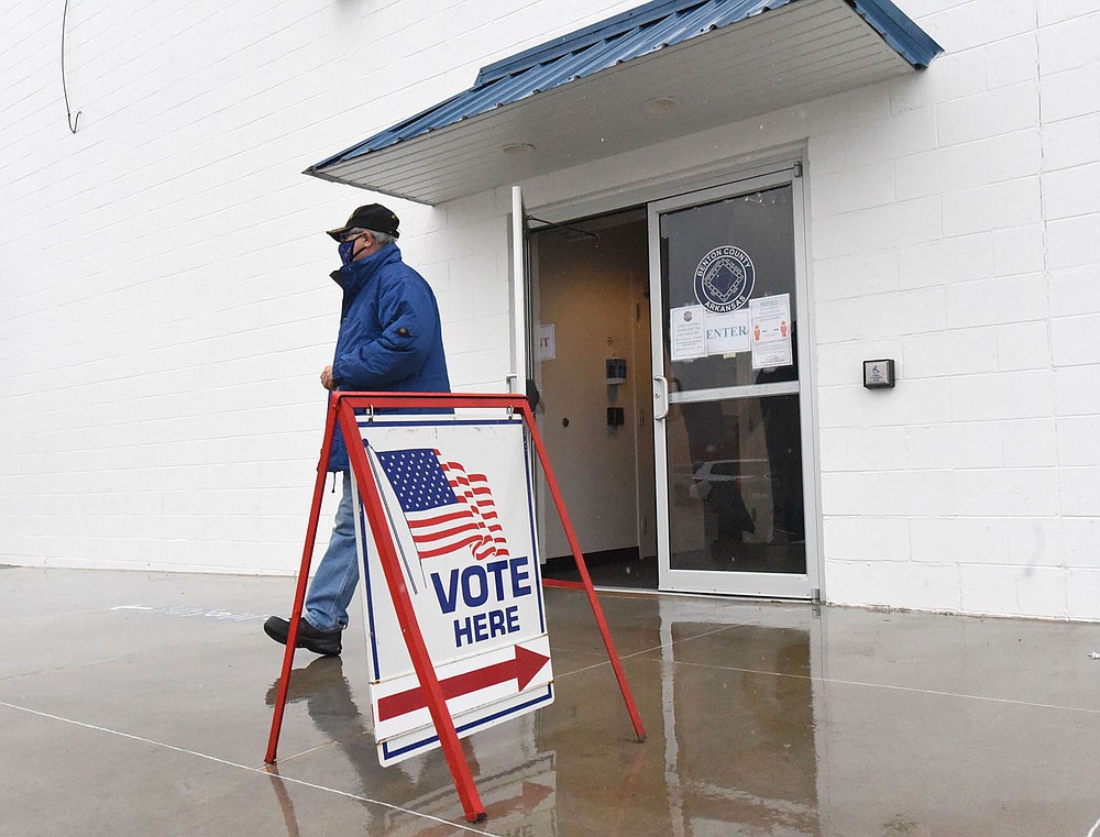 A man exits a Benton County early voting site on Wednesday Oct. 28 2020 on West Walnut Street in Rogers. 
(NWA Democrat-Gazette/Flip Putthoff)