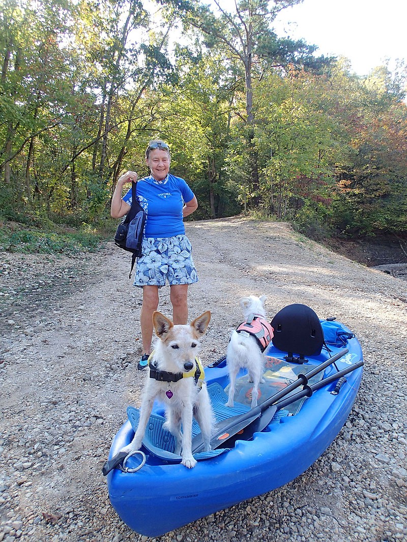 Andrea Charles of Eureka Springs is set to paddle on Oct. 7 2020 with her dogs Abby (left) and Rosie.
(NWA Democrat-Gazette/Flip Putthoff)