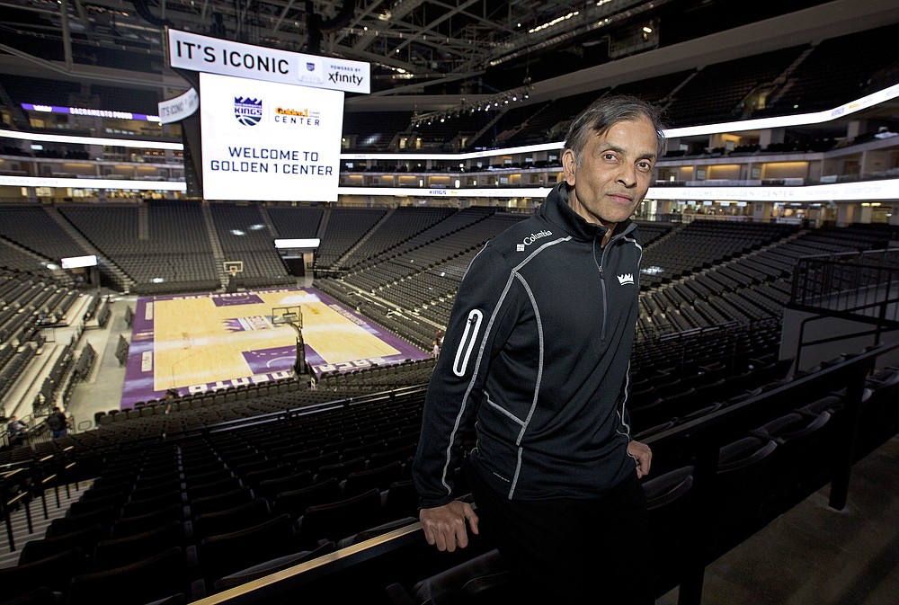 FILE - In this Sept. 27, 2016, file photo, Vivek Ranadive, the majority owner of the Sacramento Kings, poses in the new Golden 1 Center in Sacramento, Calif. Golden 1 Center will be among the places Californians in the area can vote from Saturday until the polls close on the evening of Nov. 3. “There’s no better way to make the world a better place than by making it easy for people to vote," Ranadive said in a telephone interview with The Associated Press. (AP Photo/Rich Pedroncelli, File)