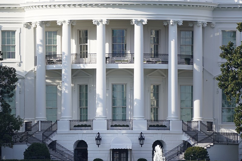 FILE - In this Oct. 5, 2020 file photo, the White House is shown Monday afternoon, Oct. 5, 2020, in Washington. President Donald Trump and Democratic rival Joe Biden’s campaigns are assembling armies of powerful lawyers as they prepare for the possibility that the race for the White House is decided not at the ballot box but in court.  (AP Photo/J. Scott Applewhite)