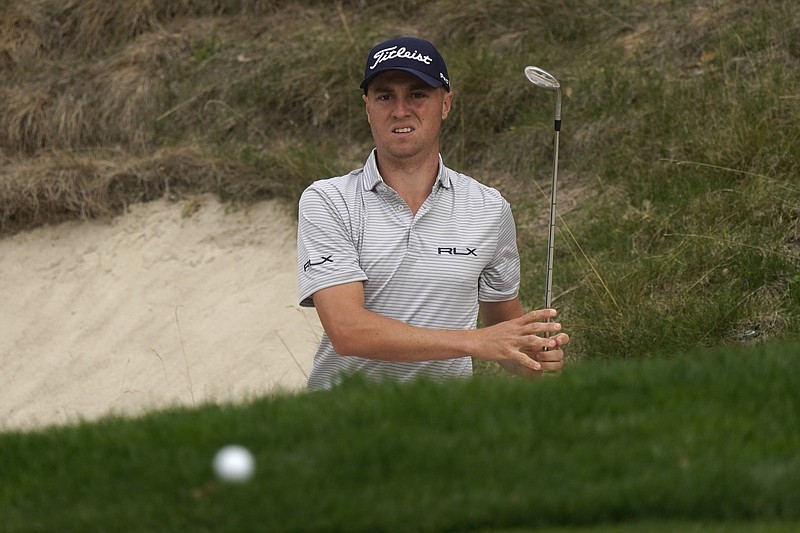 Justin Thomas hits from the bunker to the eighth green during the second round of the Zozo Championship golf tournament Friday, Oct. 23, 2020, in Thousand Oaks, Calif. (AP Photo/Marcio Jose Sanchez)