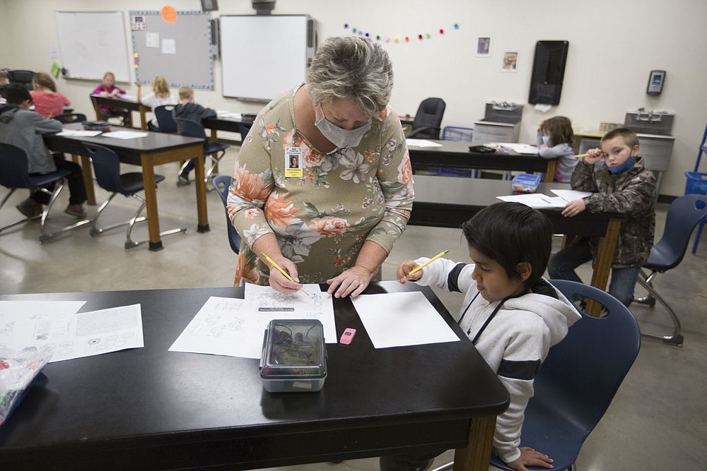 Tressa¬†Keeling, second grade art¬†teacher, helps Elias Nava with an assignment, Monday, October 5, 2020 at Clinton Elementary School in Clinton. Check out nwaonline.com/2010010Daily/ for today's photo gallery. 
(NWA Democrat-Gazette/Charlie Kaijo)