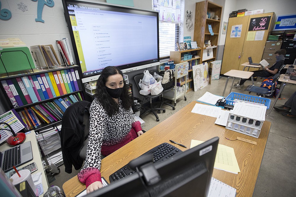 Kim¬†Trujillo, seventh grade English teacher, works on her computer, Monday, October 5, 2020 at Clinton Junior High School in Clinton. Check out nwaonline.com/2010010Daily/ for today's photo gallery. (NWA Democrat-Gazette/Charlie Kaijo)