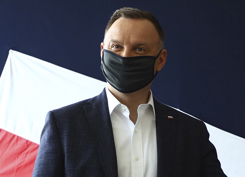 File—File picture taken June 28, 2020 shows Poland's President Andrzej Duda casting his vote during presidential election in Krakow, Poland. Duda was tested positive on Corona. (AP Photo/Beata Zawrzal, file)