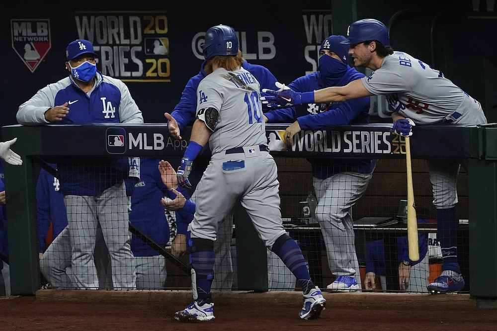 Tampa Bay Rays' Kevin Kiermaier celebrates in the dugout after a home run  against the Los Angeles Dodgers during the fifth inning in Game 1 of the  baseball World Series Tuesday, Oct.