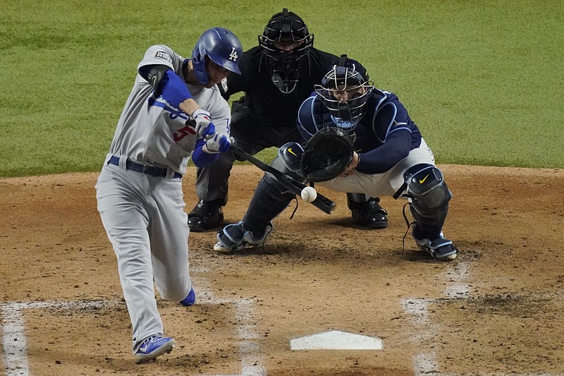 Los Angeles Dodgers' Corey Seager hits a home run against the Tampa Bay Rays Saturday during the third inning in Game 4 of the World Series in Arlington, Texas. - Photo by Sue Ogrocki of The Associated Press