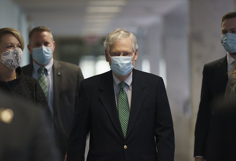 Senate Majority Leader Mitch McConnell, R-Ky., arrives as Republicans work during a rare weekend session to advance the confirmation of Judge Amy Coney Barrett to the Supreme Court, at the Capitol in Washington, Sunday. - AP Photo/J. Scott Applewhite