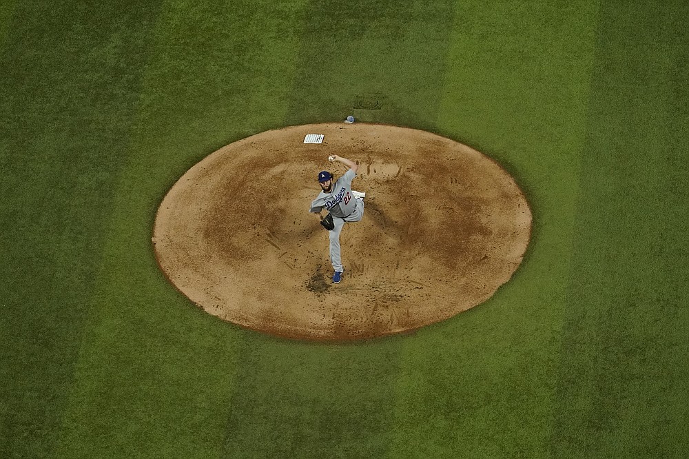 Los Angeles Dodgers starting pitcher Clayton Kershaw throws against the Tampa Bay Rays during the first inning in Game 5 of the baseball World Series Sunday, Oct. 25, 2020, in Arlington, Texas. (AP Photo/David J. Phillip)