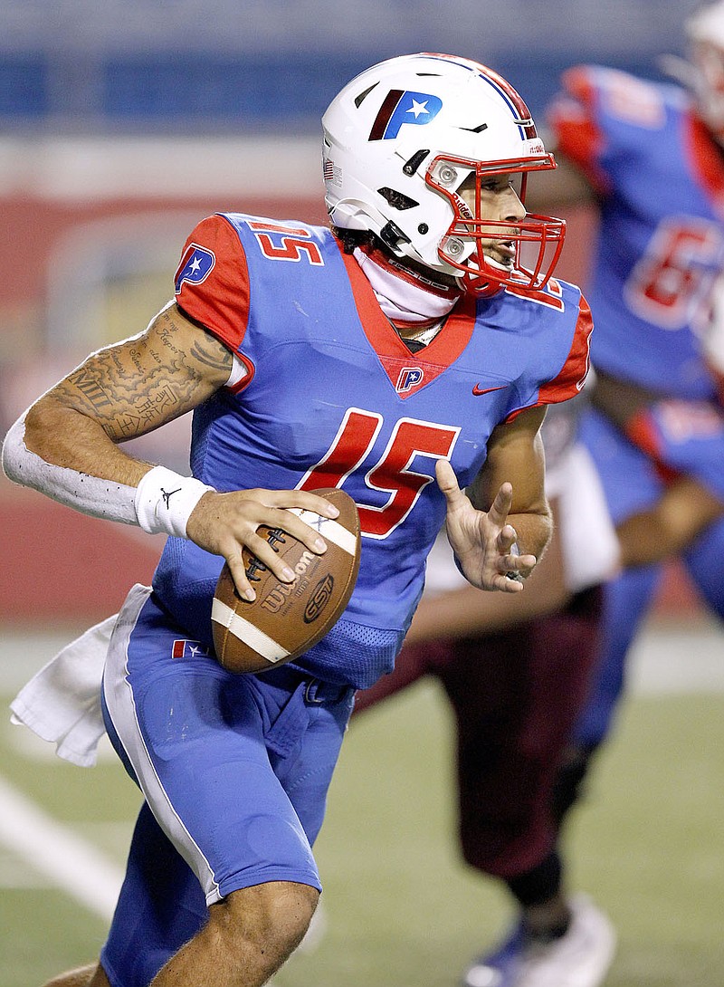 Thomas Metthe/Arkansas Democrat-Gazette
Little Rock Parkview quarterback Landon Rogers (15) rolls out for a pass during the third quarter of Parkview's 30-20 loss to Benton on Friday, Oct. 9, 2020, at War Memorial Stadium in Little Rock.