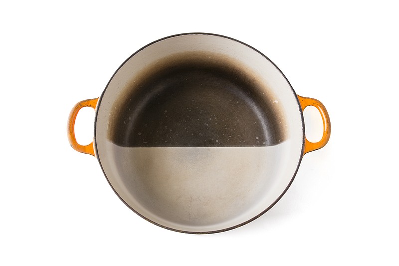 Chefs like Dutch ovens coated in light-colored enamel because it helps them judge doneness. Though these pans won’t acquire seasoning like cast iron, their light surfaces can darken. To restore them, make a solution of one-part bleach and three parts water and let the mixture soak in the pan overnight. (Steve Klise for America's Test Kitchen via Marni Jameson)