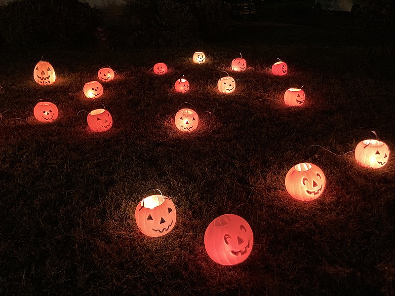 Although door-to-door trick-or-treating is considered a very scary activity by the CDC in terms of possible exposure to covid-19, other Halloween events, such as the Police Department's scavenger hunt, are available for those wanting a safer experience. Here, lit up jack-o-lanterns decorate a Pine Bluff lawn on Martin Street.(Pine Bluff Commercial/Byron Tate)